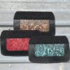 Three paisley-print leatherette wallets.