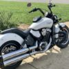A motorcycle parked on the side of a road.