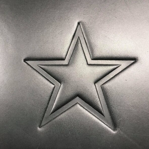 A star cookie cutter sitting on top of a table.