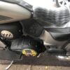 A motorcycle with the seat and back covered in leather.