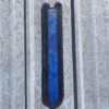A blue strip on the side of a building.