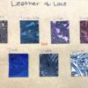 A board with different colors of leather and lace.