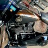 A close up of the engine and seat on a motorcycle.