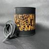 A leather bracelet with a snake print on it