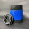 A blue and black leather wrapped container with some black string