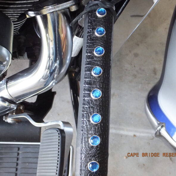 Motorcycle crash bar wrapped with blue crystals