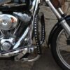 A close up of the front wheel on a motorcycle.