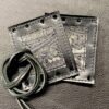A pair of leather wallets with a string on the side.
