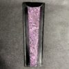 A purple and black leather wallet with a floral design.