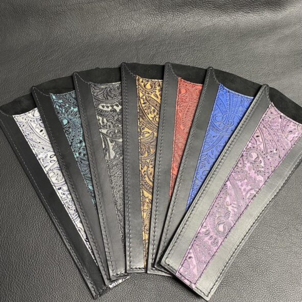 A set of seven different colored wallets.