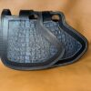 A pair of black leather bags with a crocodile pattern.