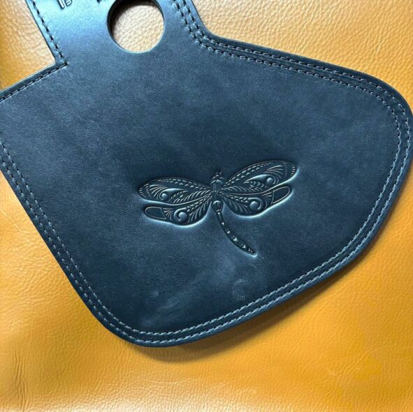 Indian heat shield with dragonfly embossing