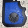 Blue leather holster with embossed emblem.